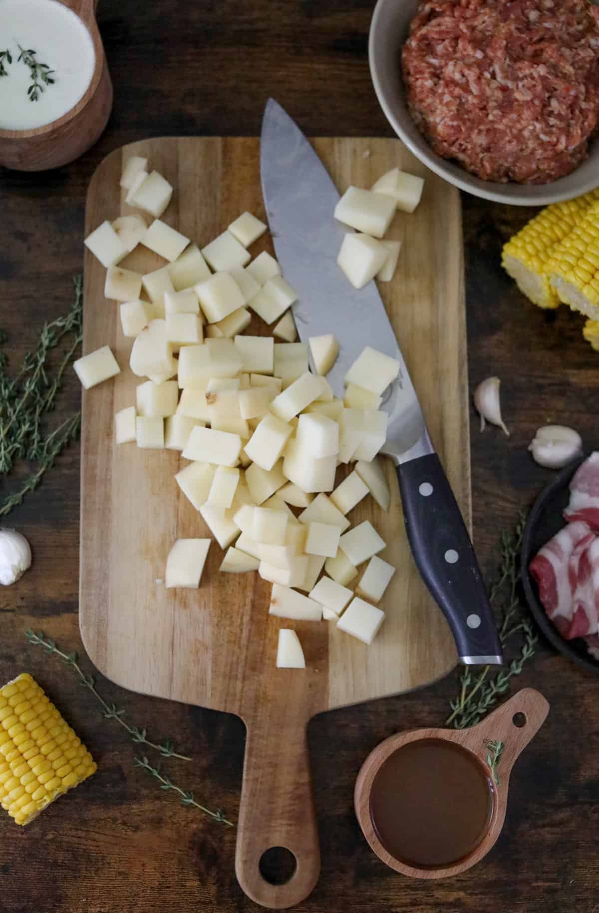Potatoes on a cutting board.