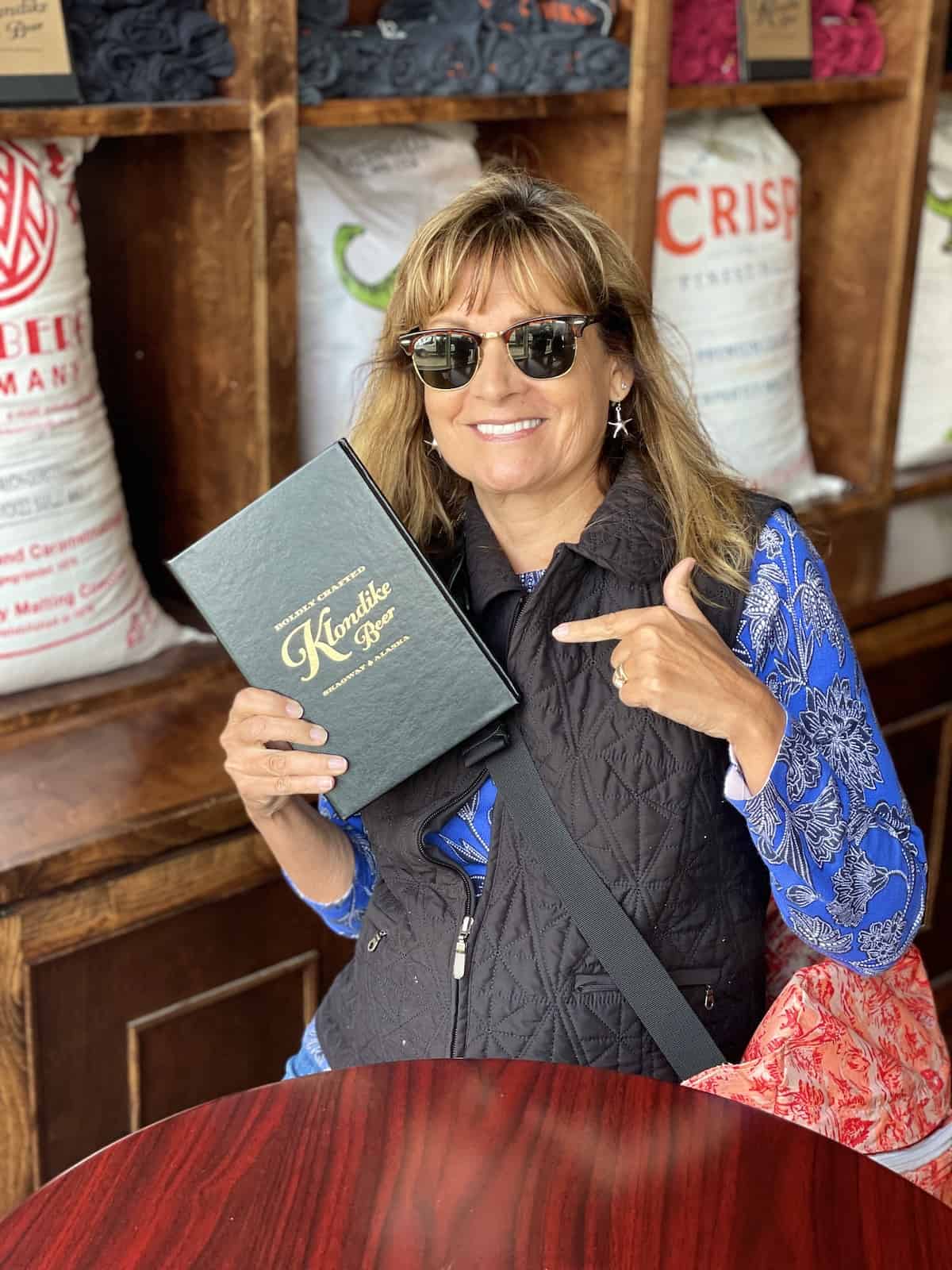 Woman holding a menu.