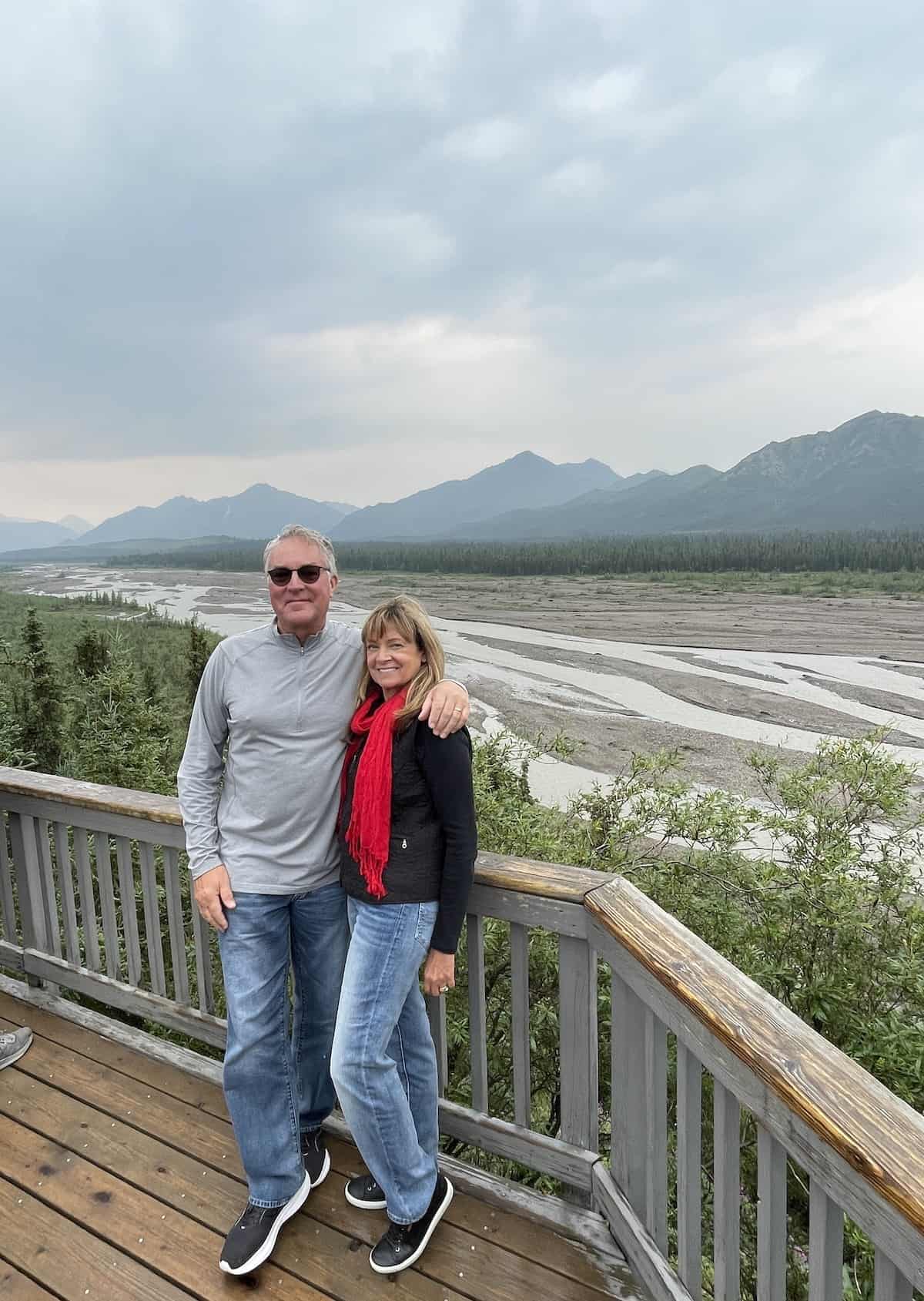 Man and woman at a photo stop near Denali.