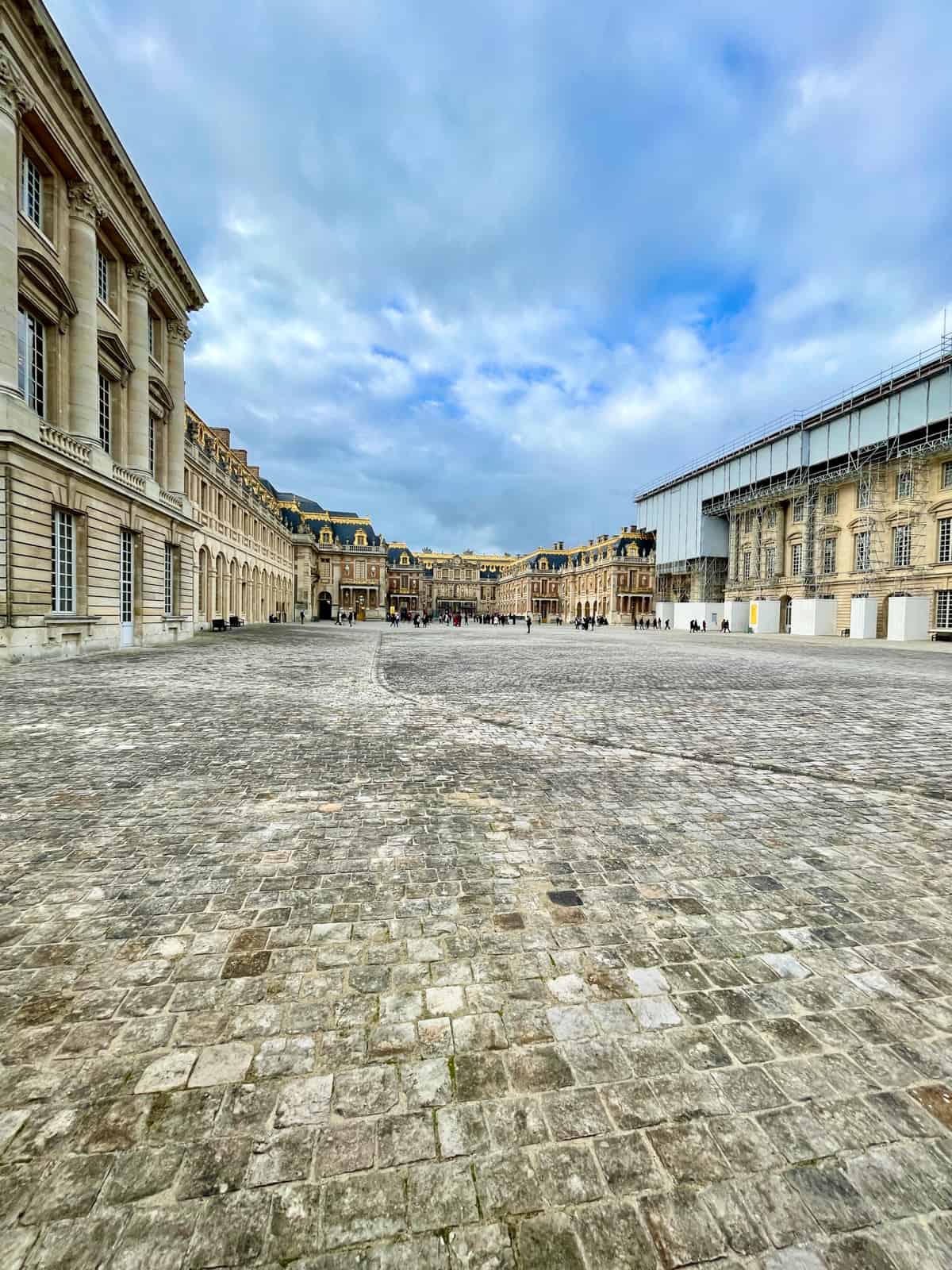 Palace of Versailles on a sunny day.