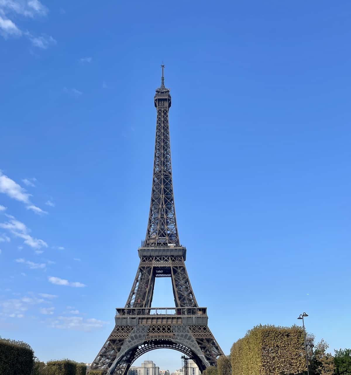 Eiffel Tower in Paris against a blue sky.