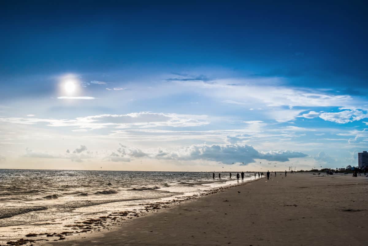 Beach with sun setting.