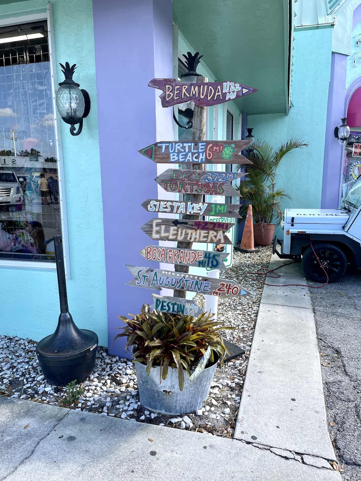 Sign showing distances from Siesta Key.