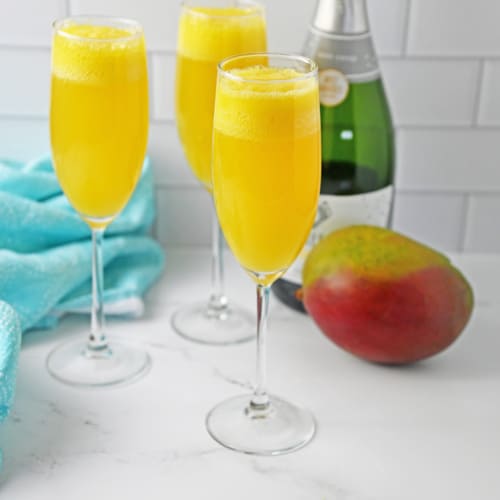 Mango mimosa in a champagne flute.