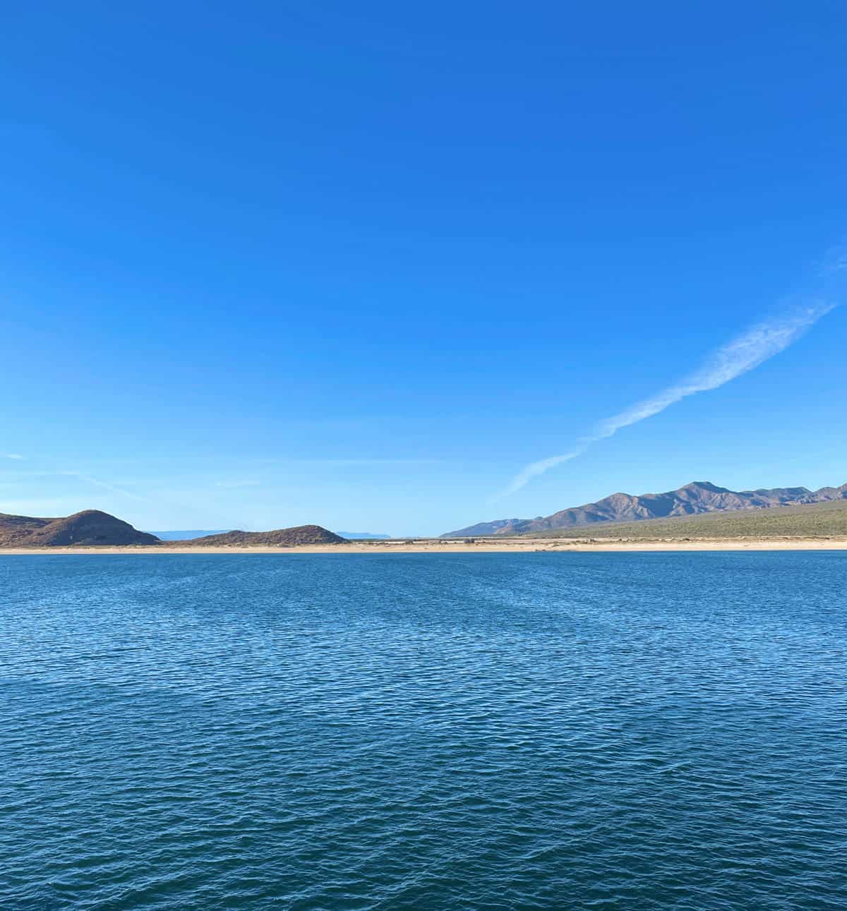 View of shore and mountains from a boat in Baja Mexico.