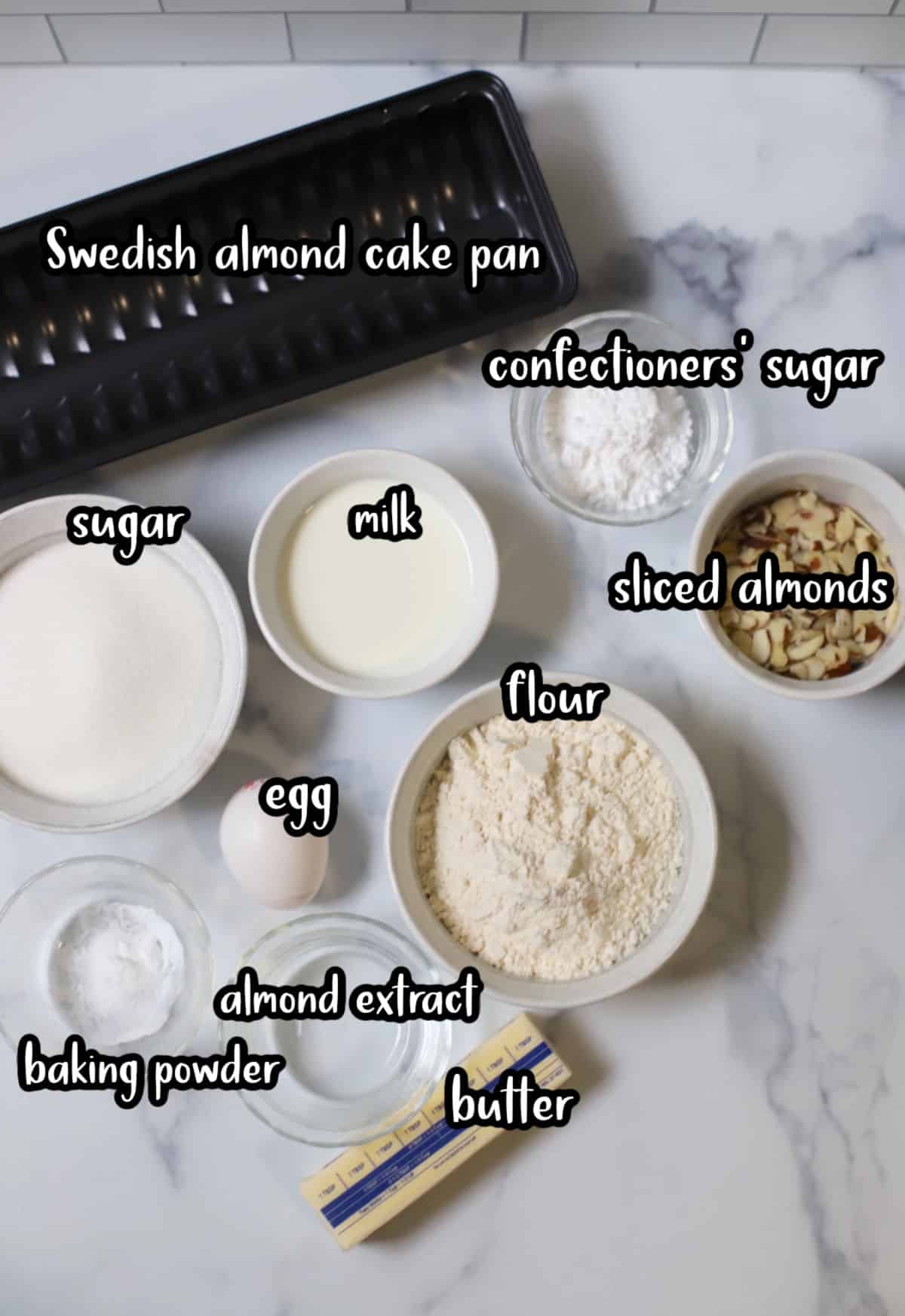 Ingredients to make Swedish almond cake on white counter.