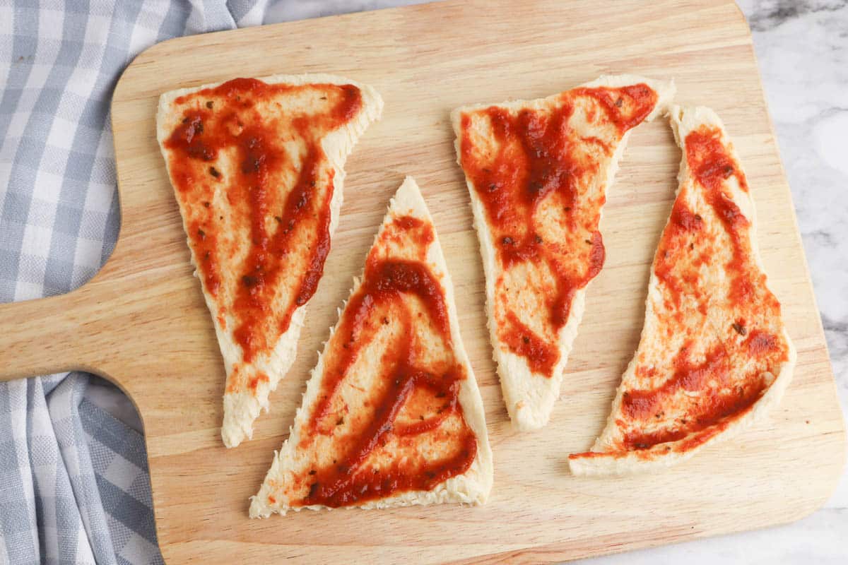 Crescent roll dough with pizza sauce.