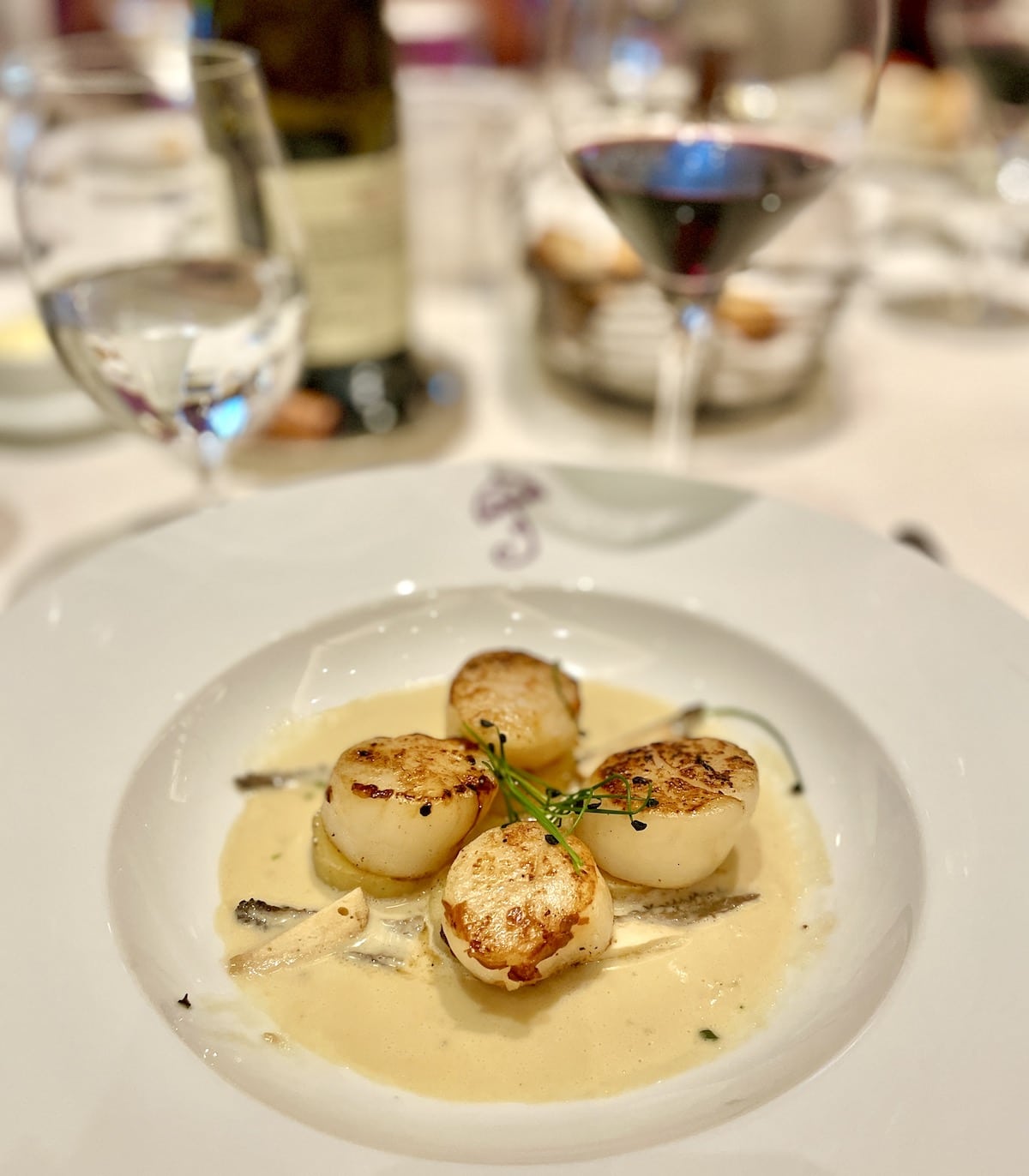 Scallops over potatoes and morels.