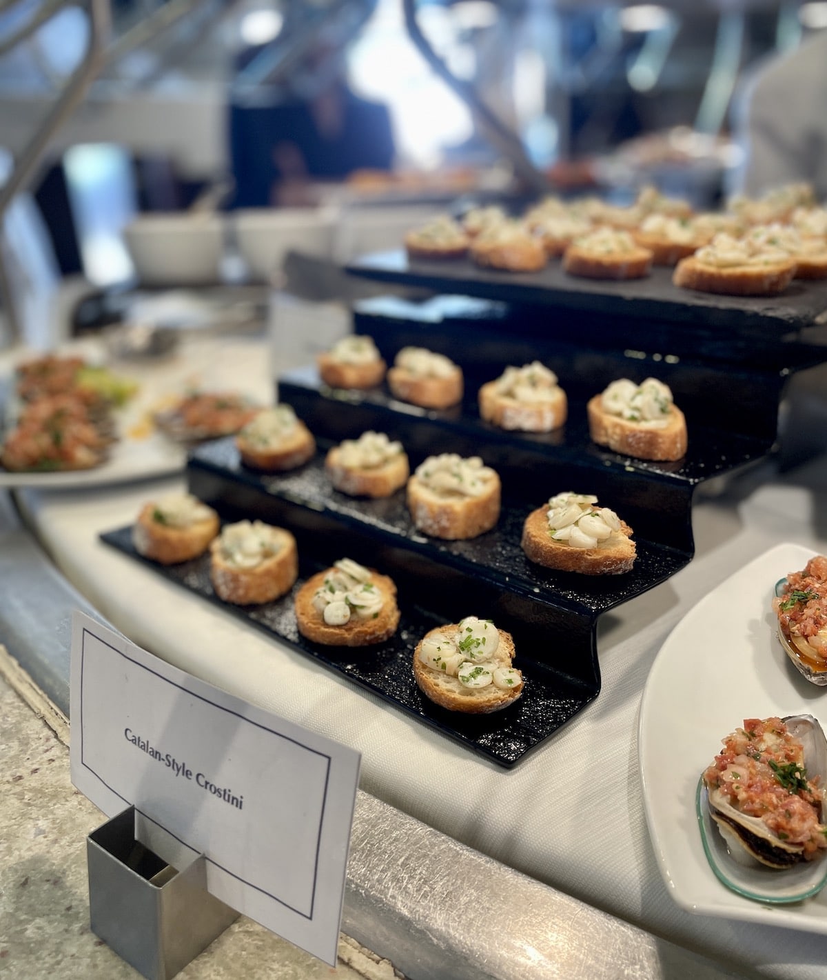 Crostini on a black display.