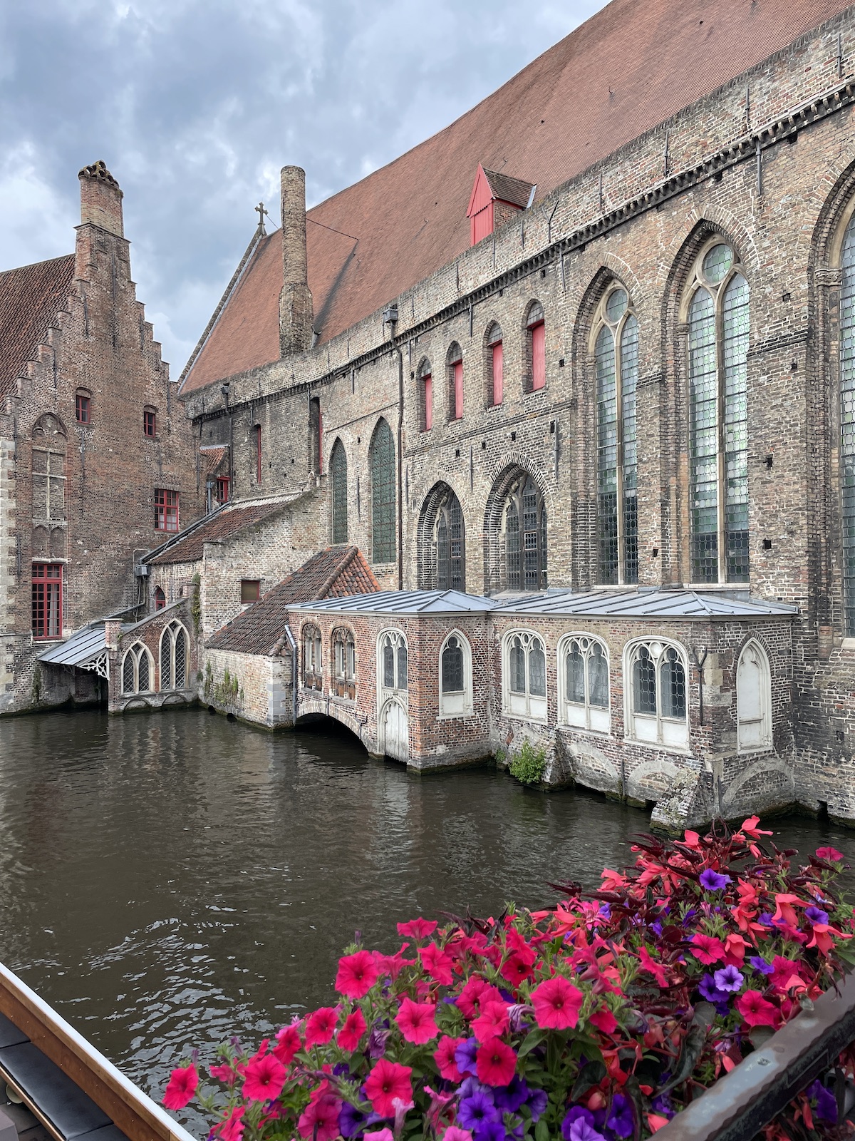 Flowers with old building in background.