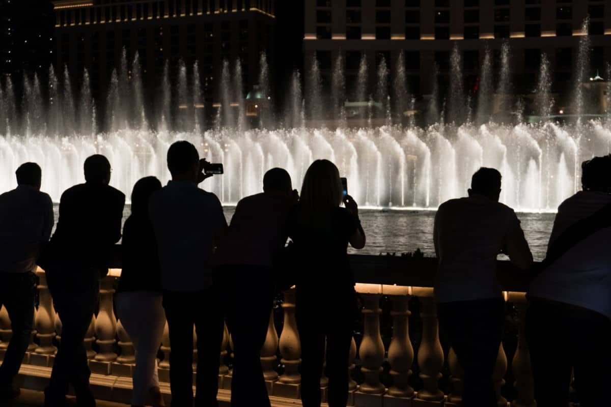 People watching the Bellagio Hotel Las Vegas fountain show at night.