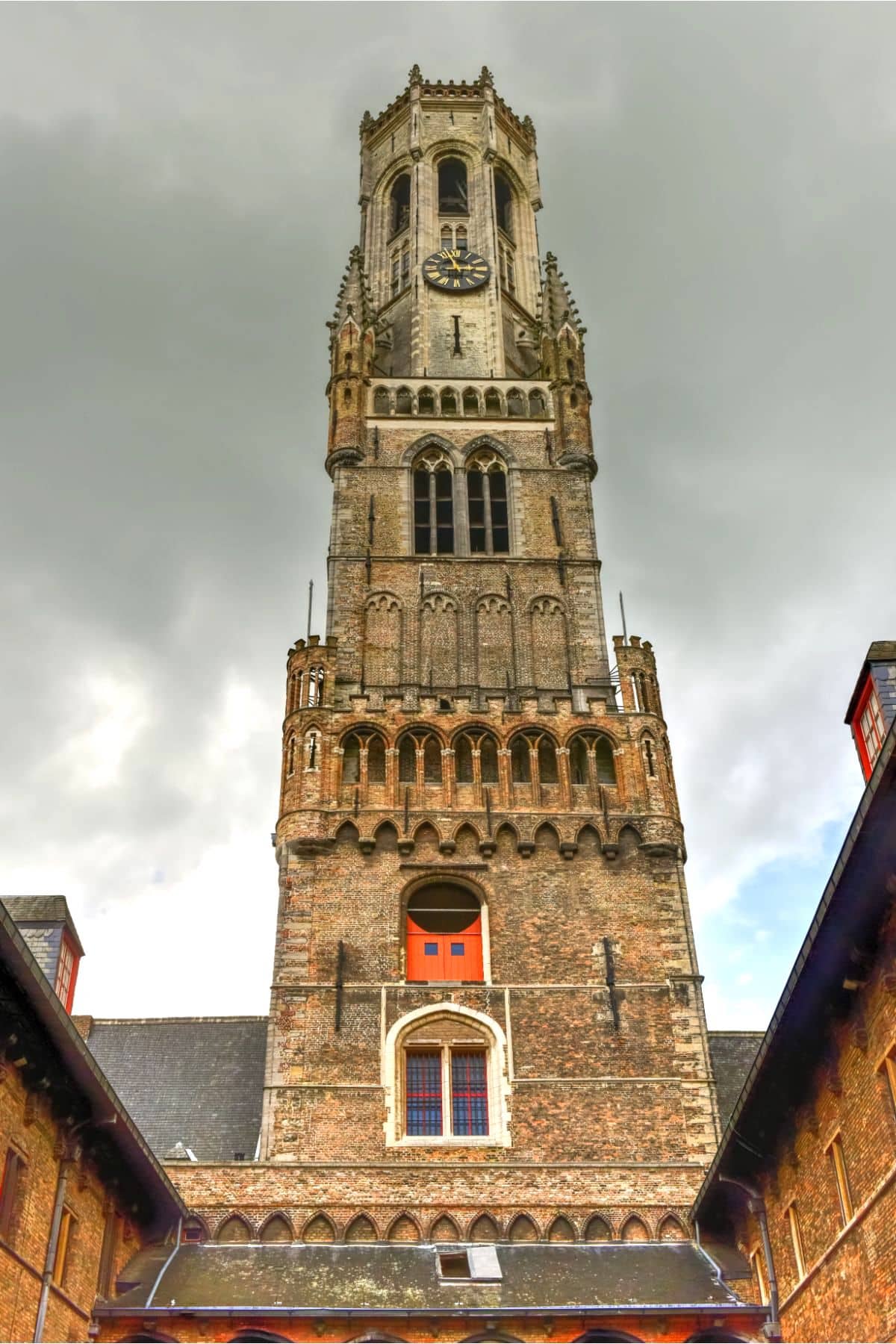 Bell tower against cloudy sky.