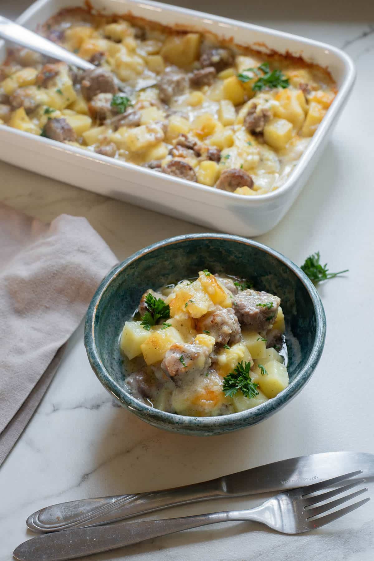 Potato and sausage casserole with cheese.