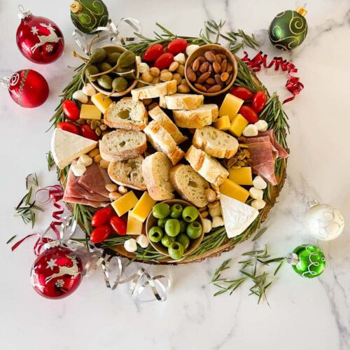 Christmas charcuterie board on a white counter.