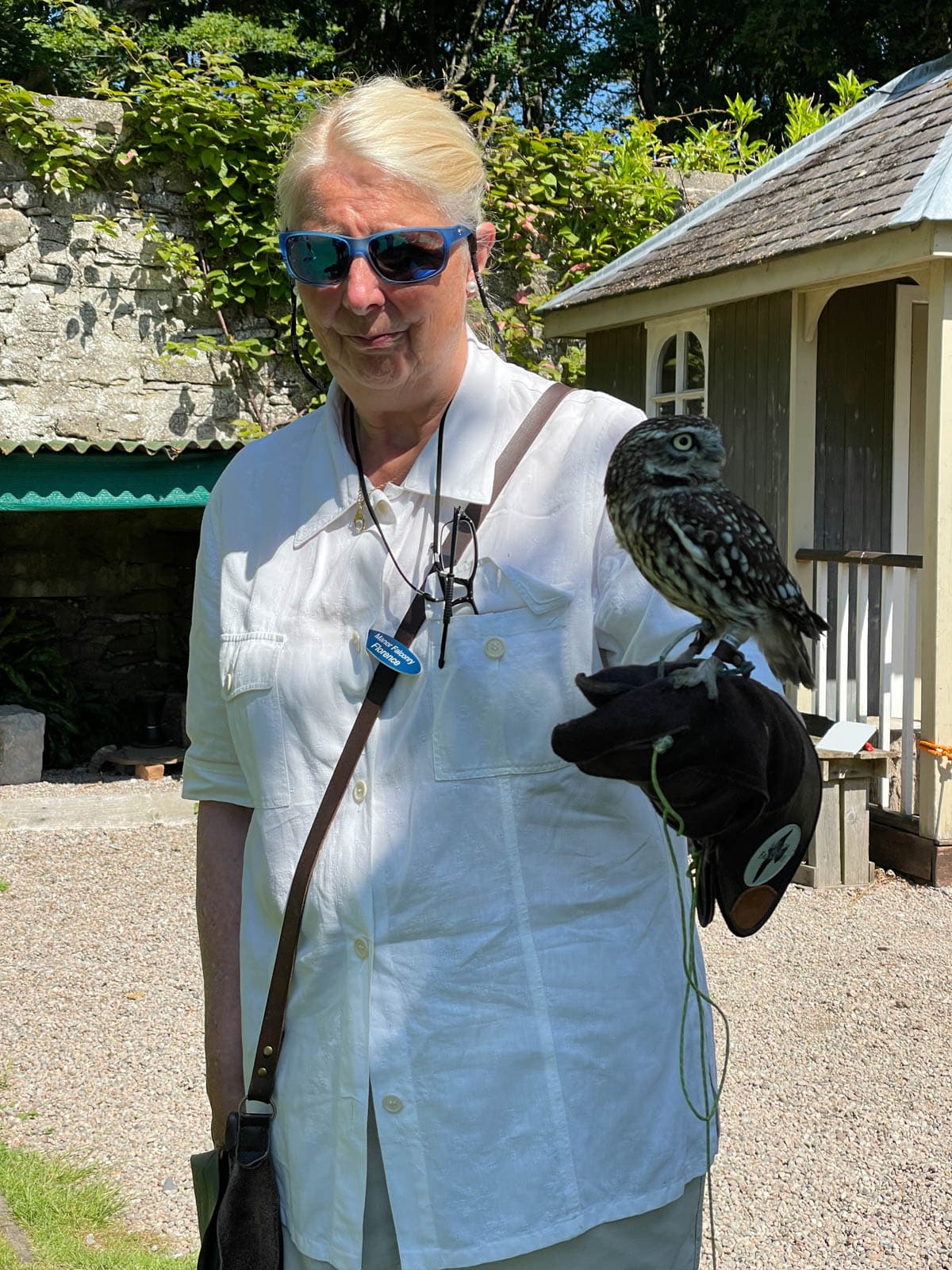 Woman holding an owl.