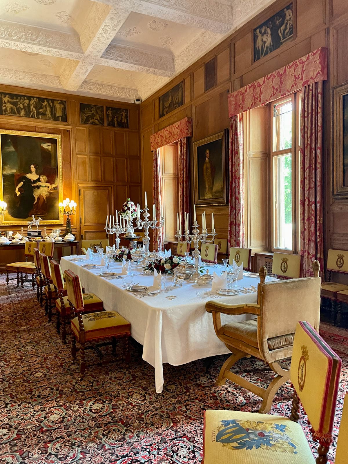 Formal dining room with table set.