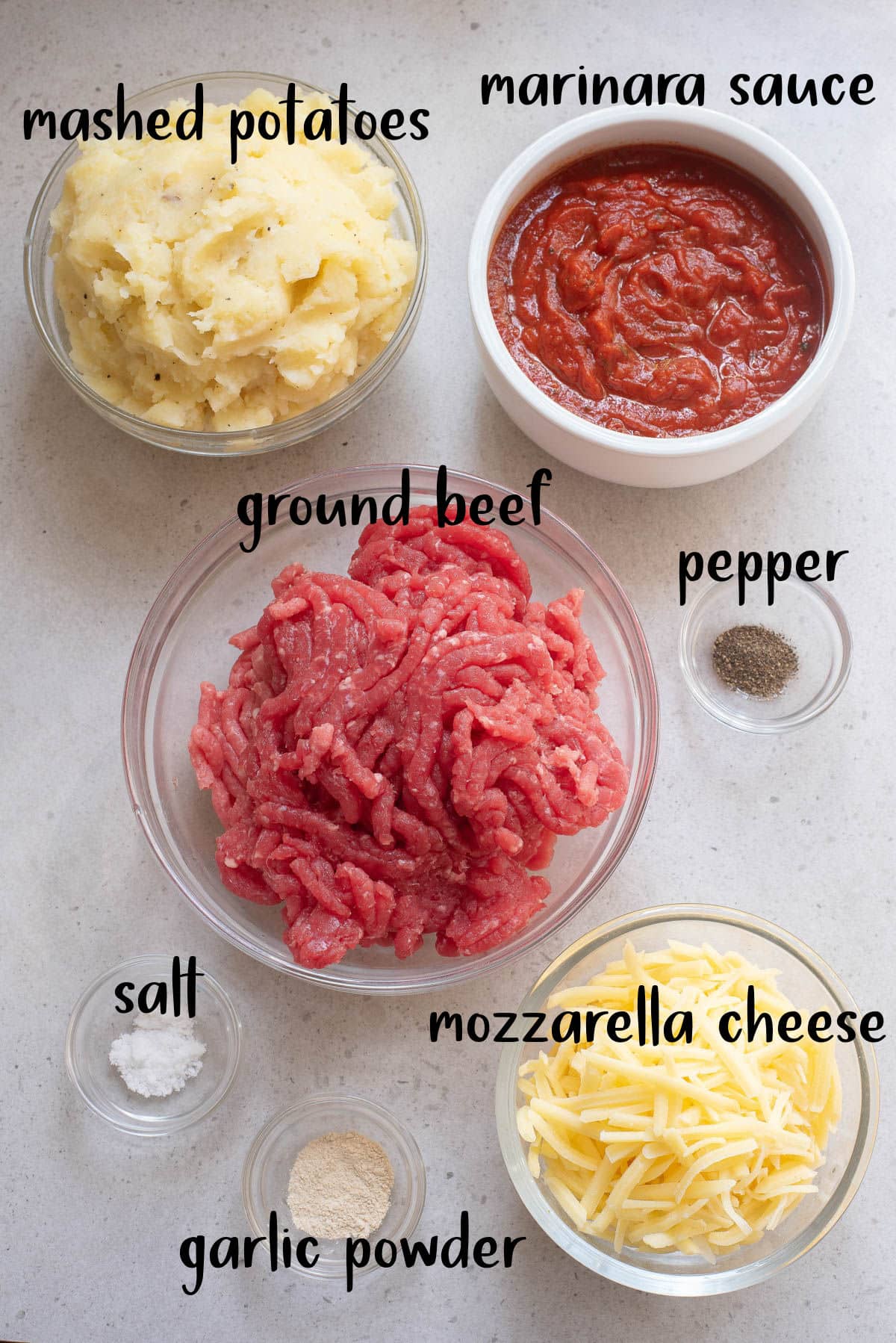 Ingredients to make a meatball and potato casserole.