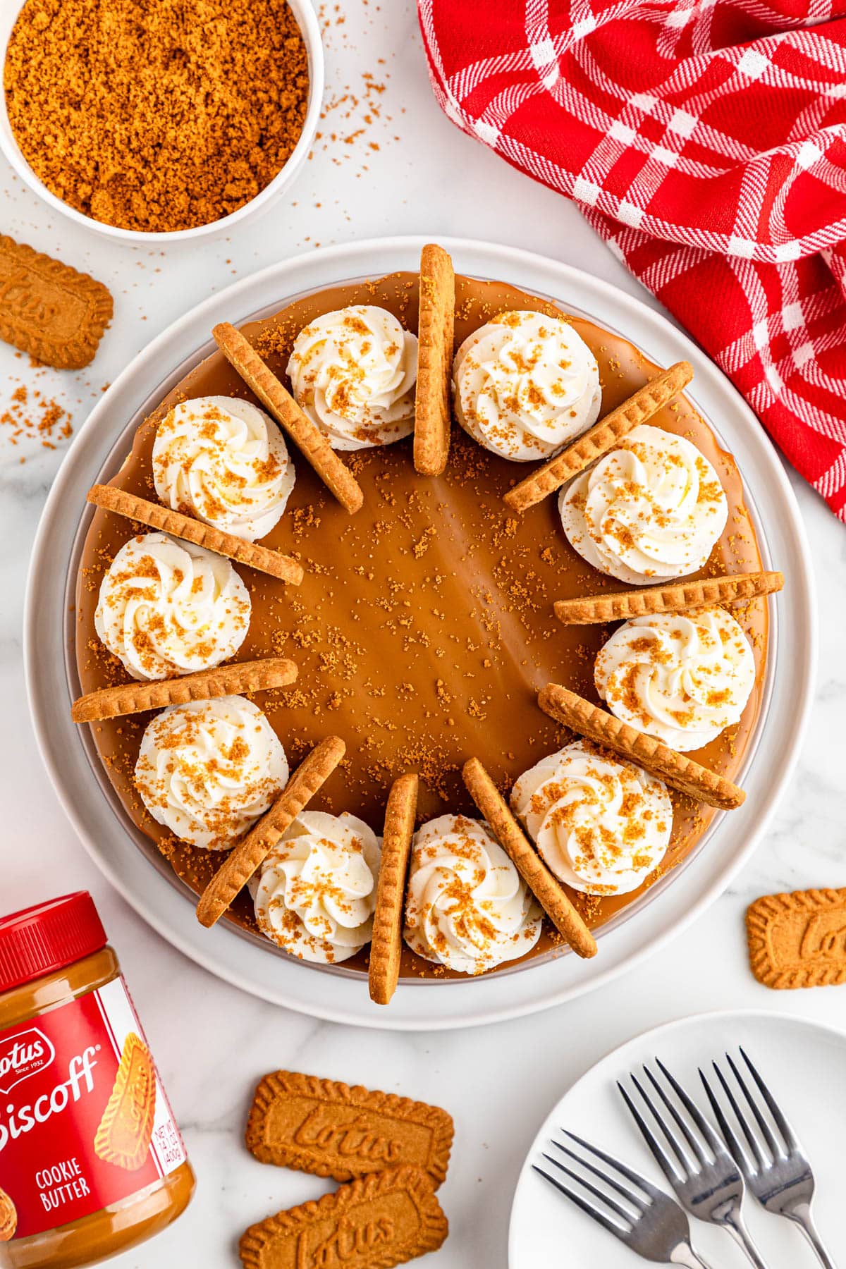 Cheesecake with cookies, Biscoff butter, and whipped cream.
