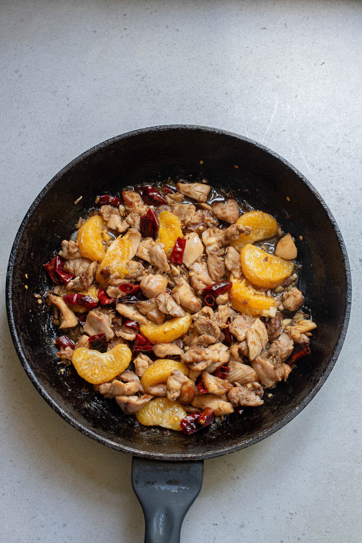Mandarin chicken in a cast iron pan.