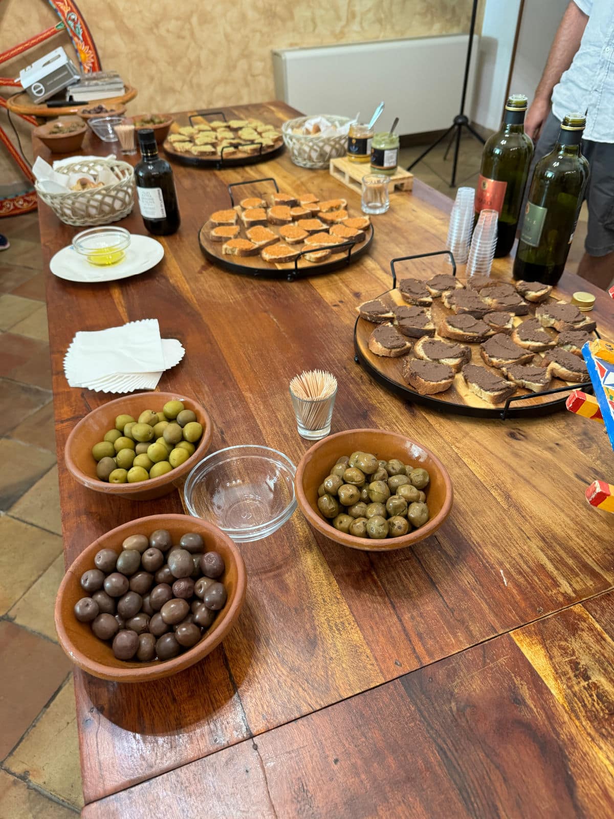 Olives and bruschetta on table.