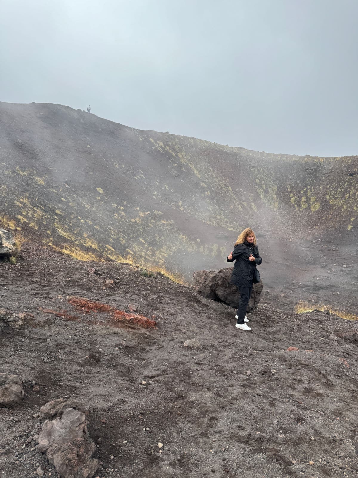 Woman on volcano.
