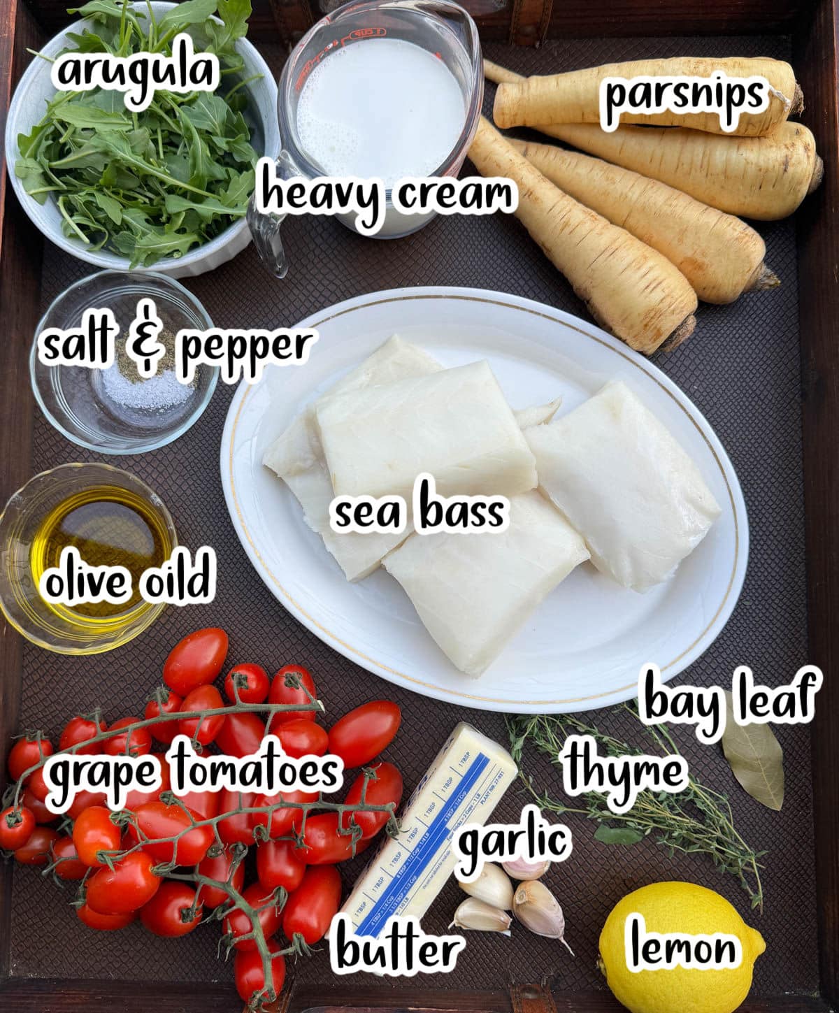 Ingredients listed include arugula, cream, parsnip, salt and pepper, sea bass, olive oil, tomatoes, butter, garlic, lemon, and herbs.
