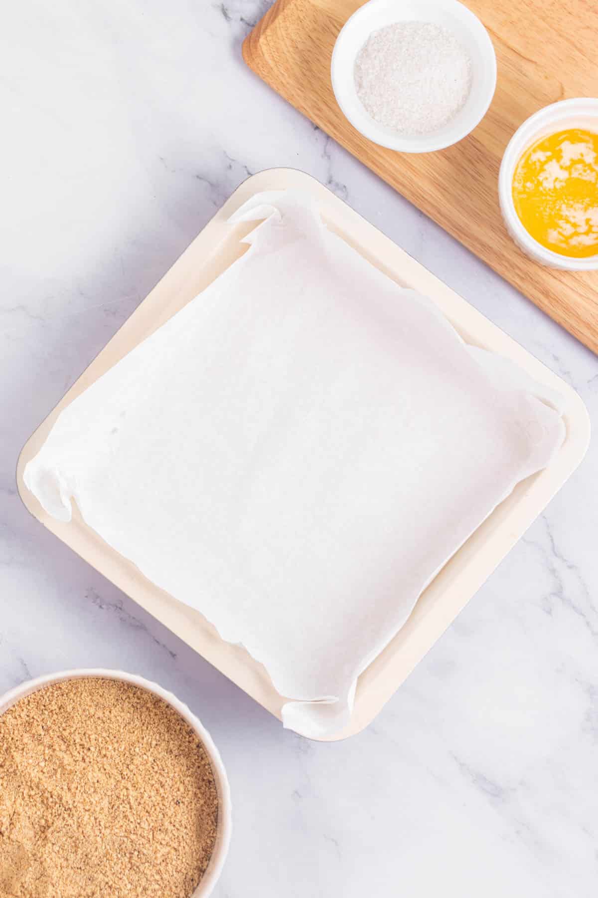 Square pan lined with parchment paper.