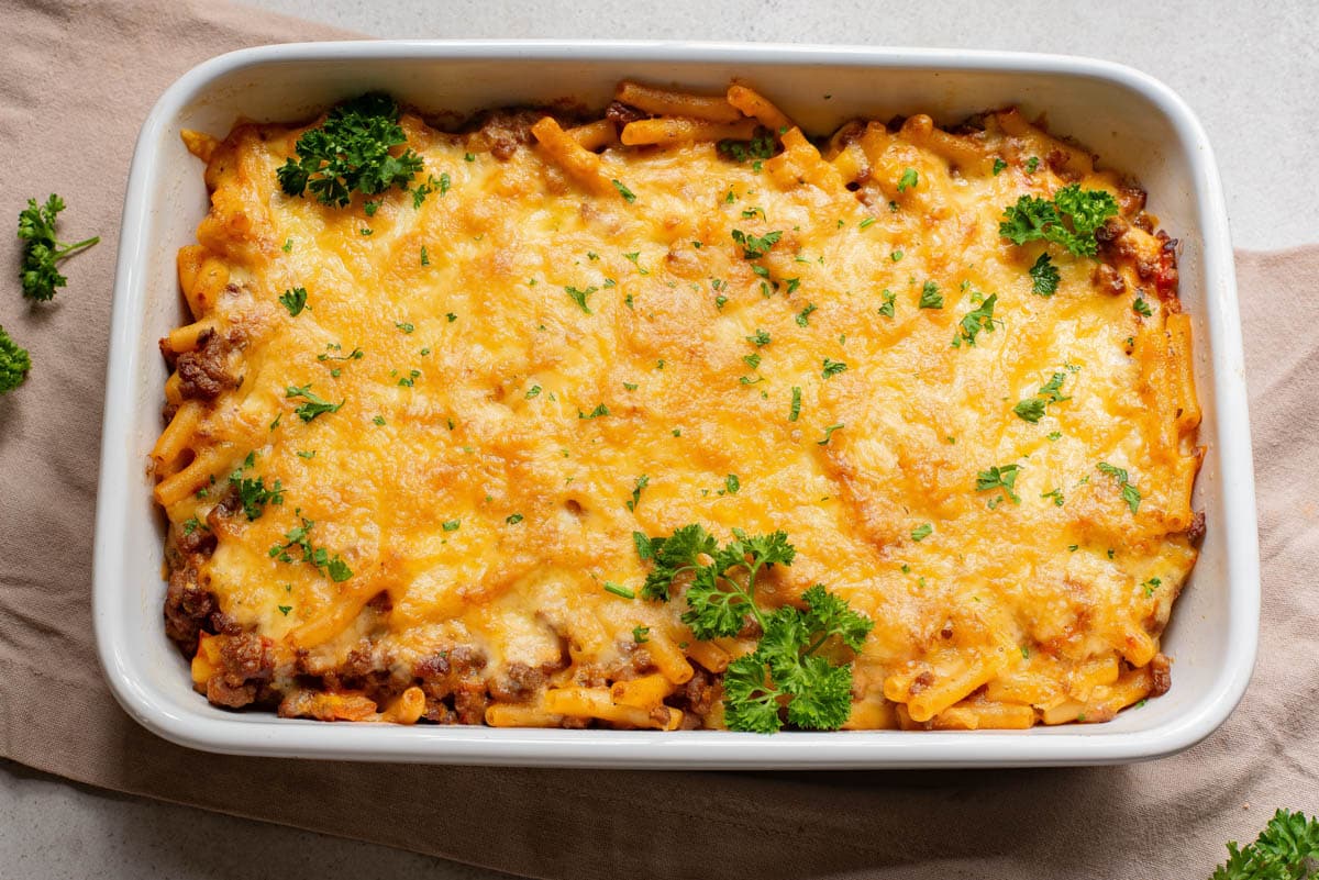 Baked pasta casserole topped with parsley.