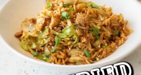 Egg fried rice in a white bowl with chopsticks in front and serving bowl in back graphic for Pinterest.