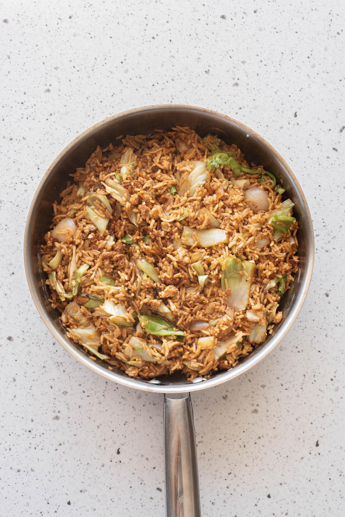 Egg fried rice in frying pan.