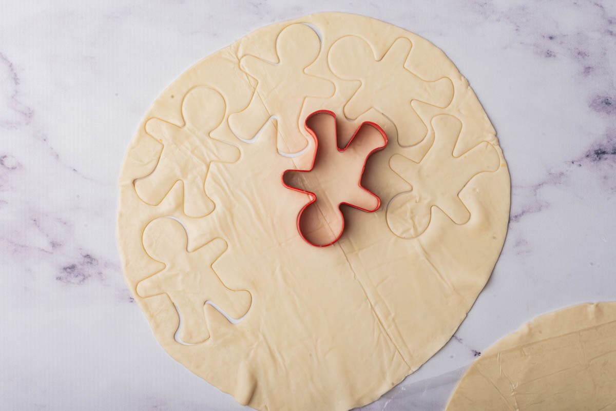 Dough with cookie cutter in center.