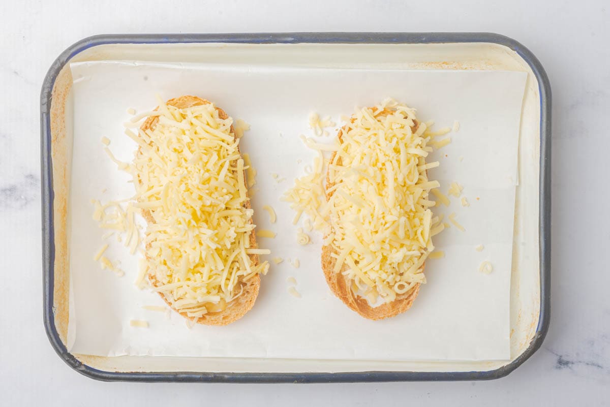 Baguette bread slices topped with cheese.