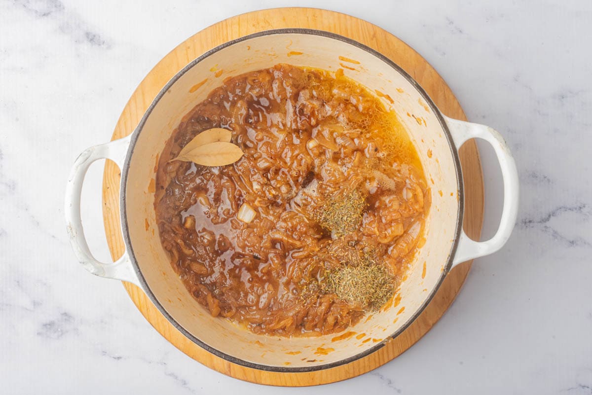 Caramelized onions in a pot with spices.