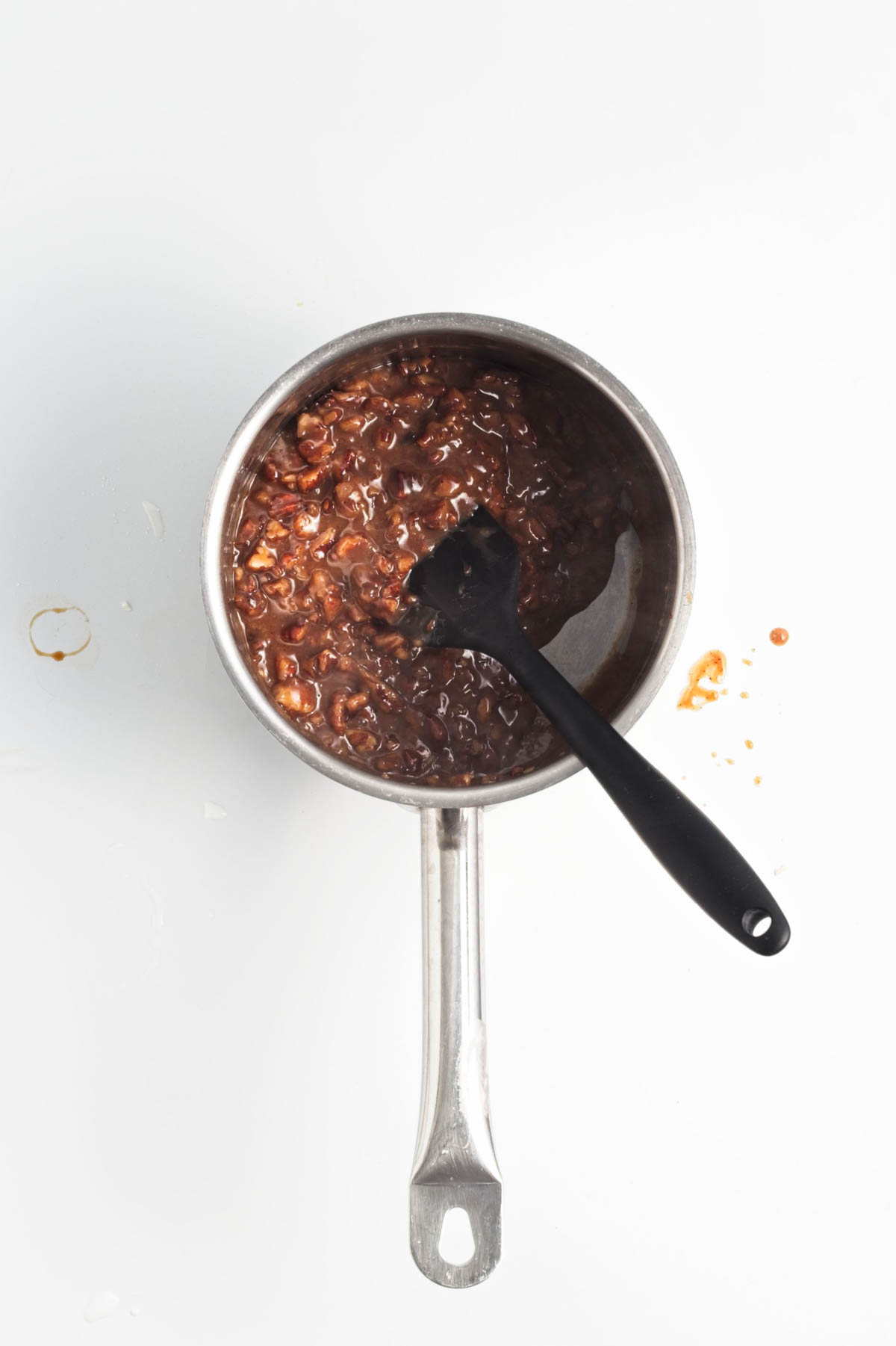 Pecan pie filling mixture in a small saucepan.