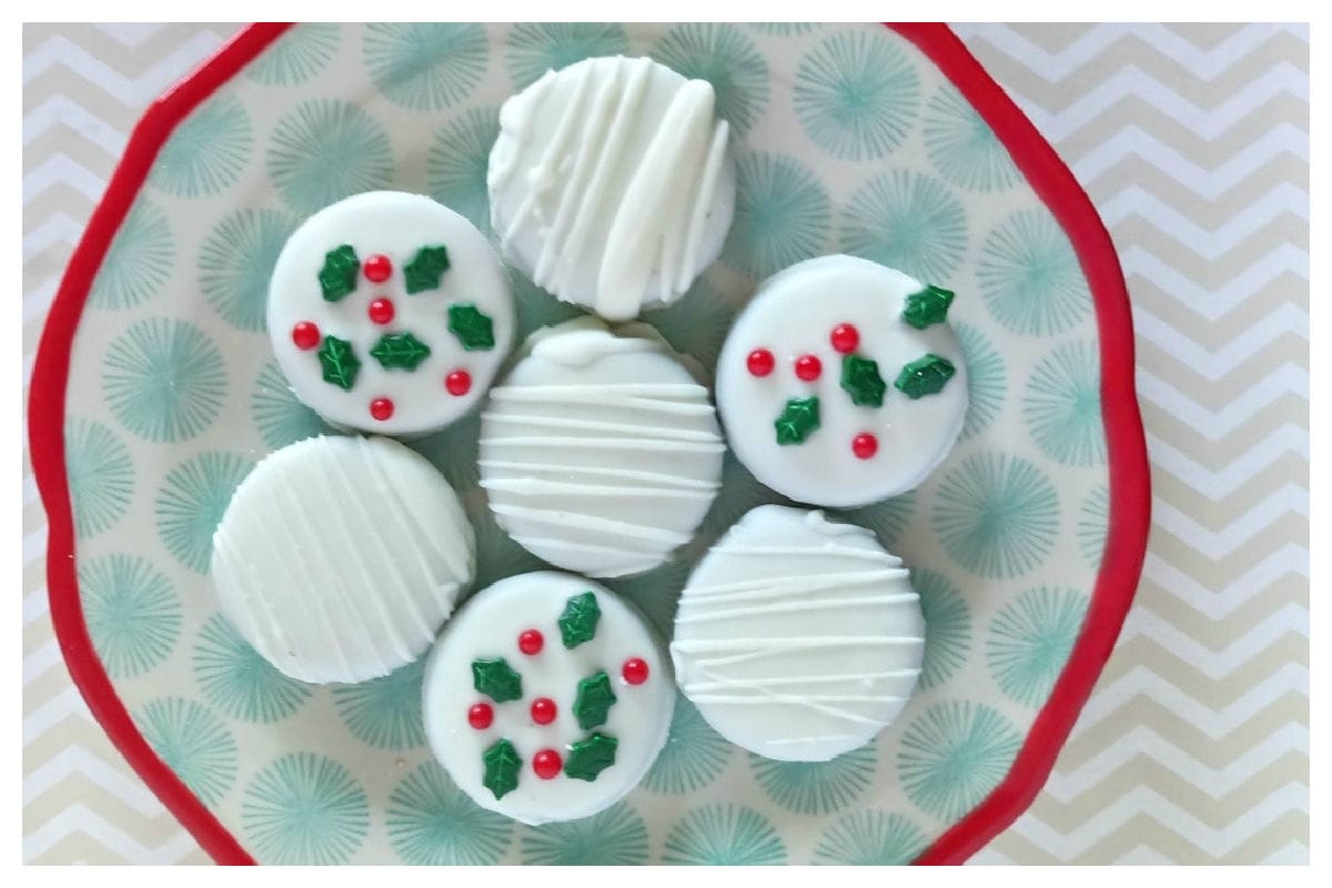 White chocolate dipped cookies with holly candies.