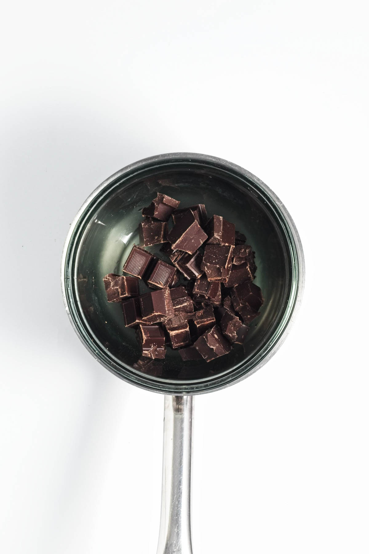 Pieces of chocolate in a saucepan.