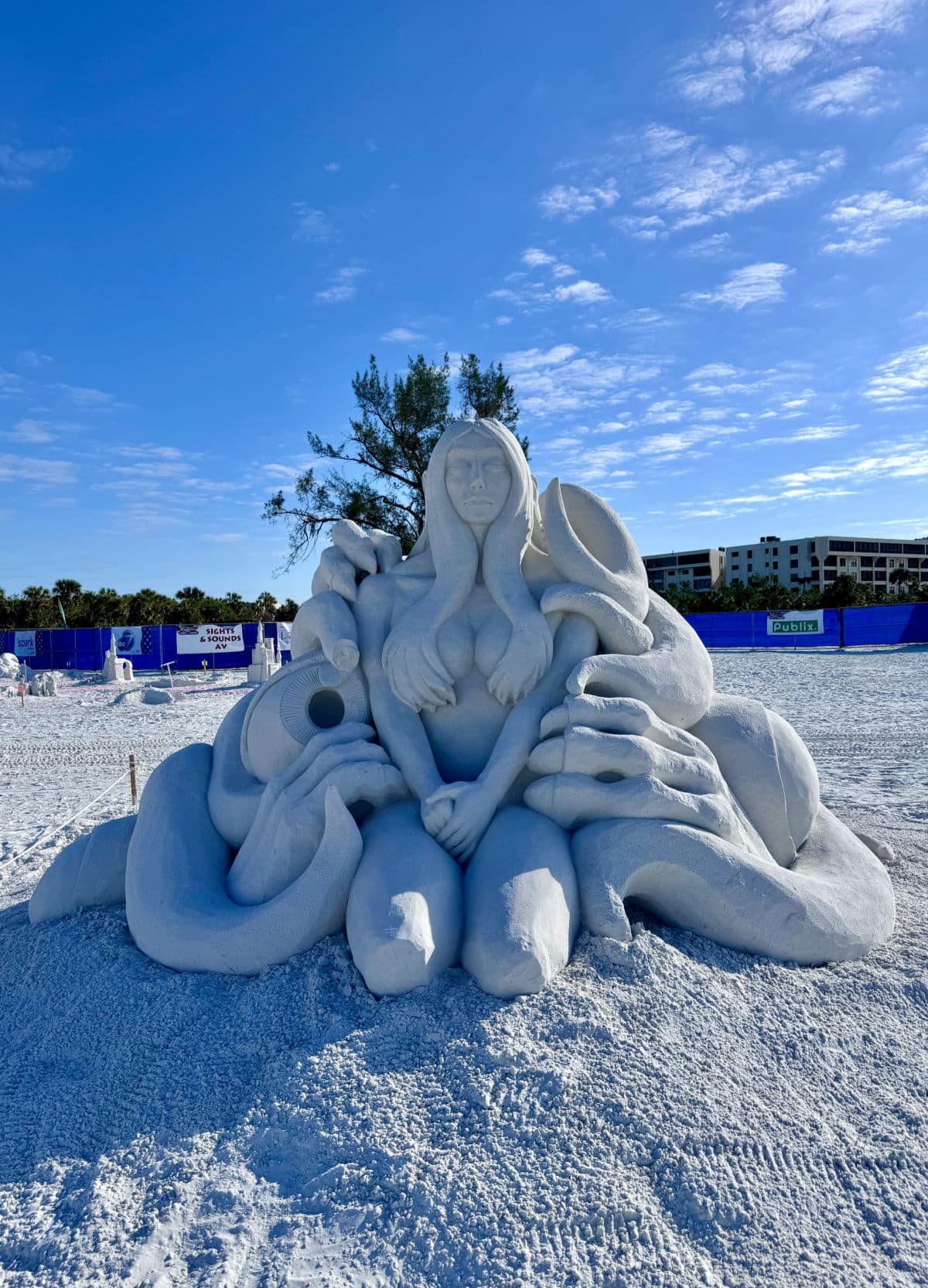 Sand sculpture of woman on the beach in Siesta Key.