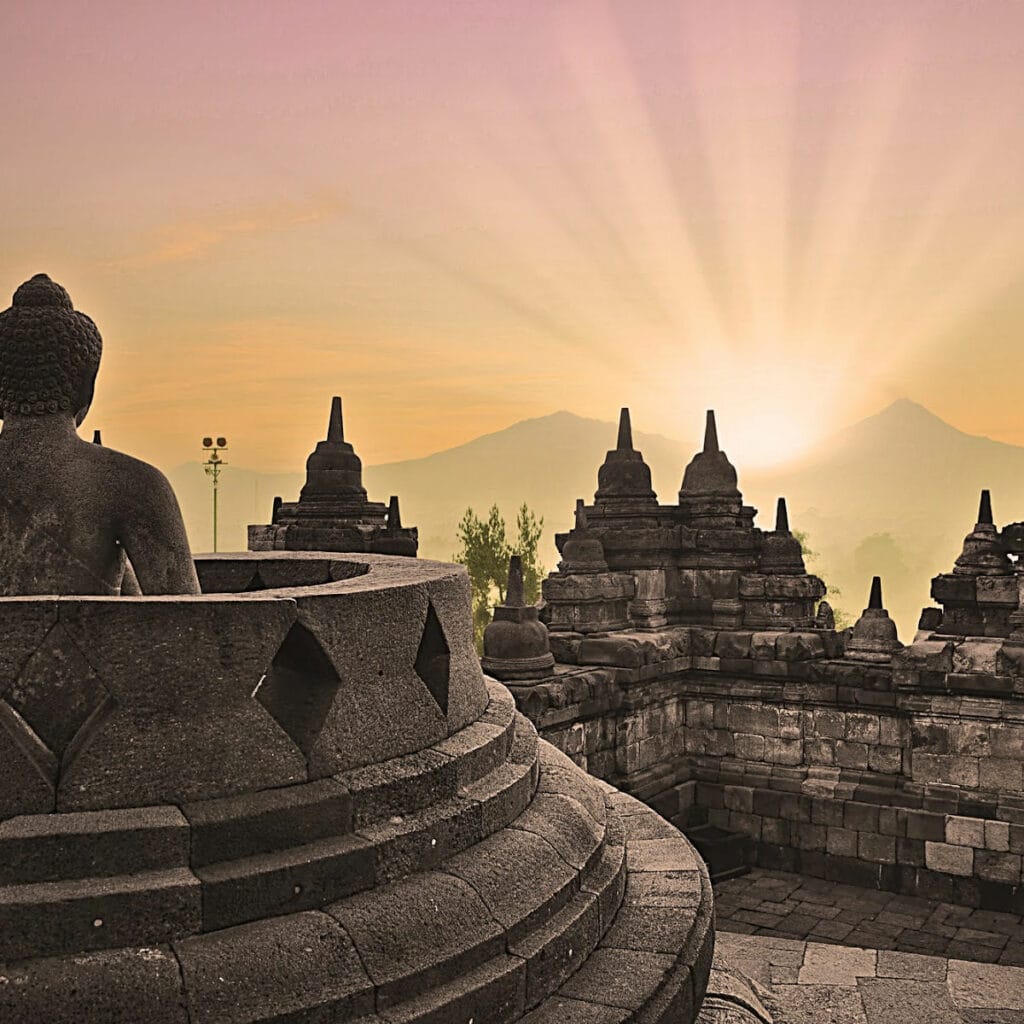 Stone temple with Buddha and golden sunlight