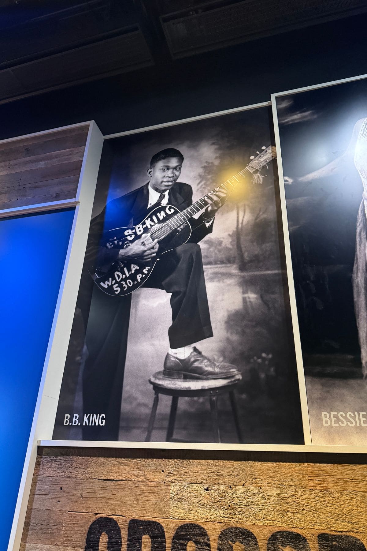 Black and white photo of BB King in a museum.