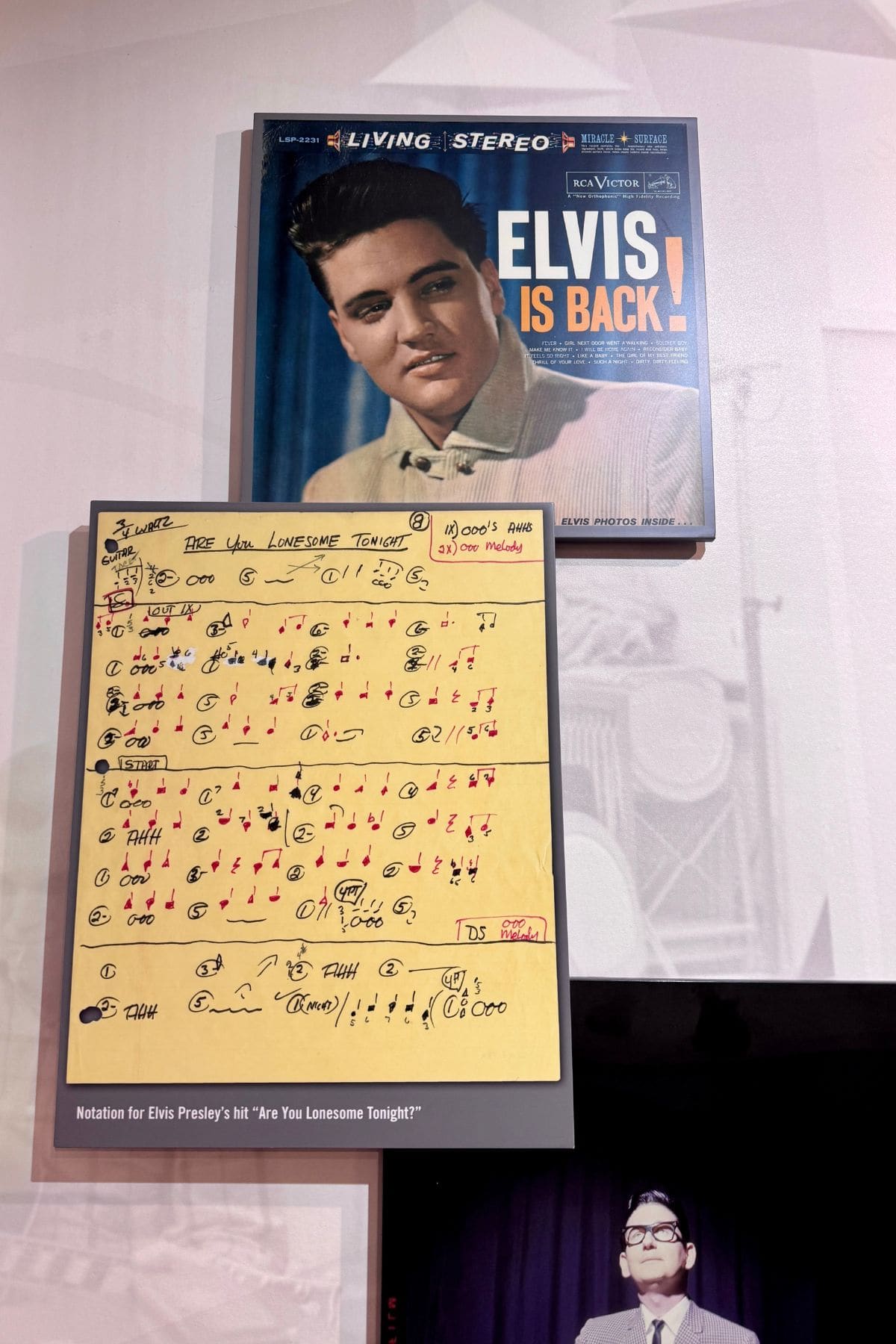 Record album of Elvis Presley along with sheet music he wrote.