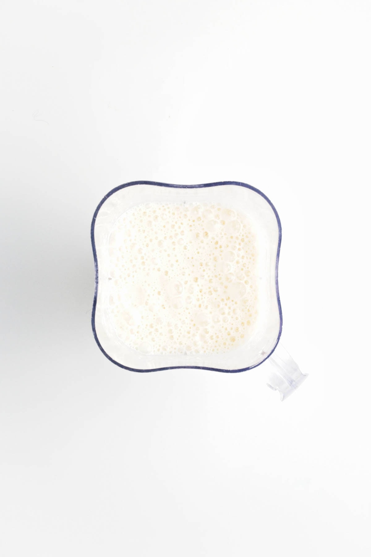 White liquid in blender.