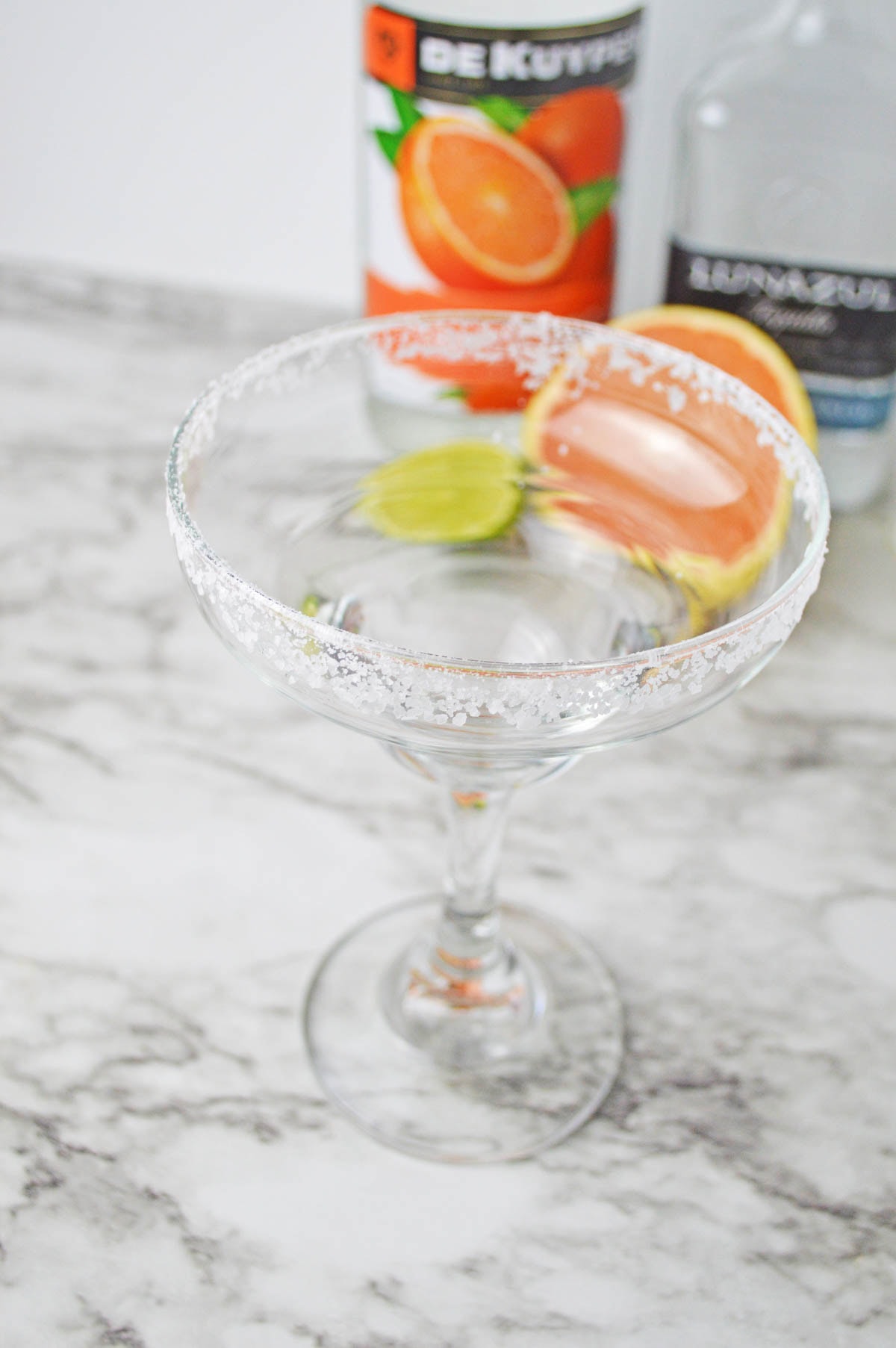 Cocktail glass rimmed with salt.
