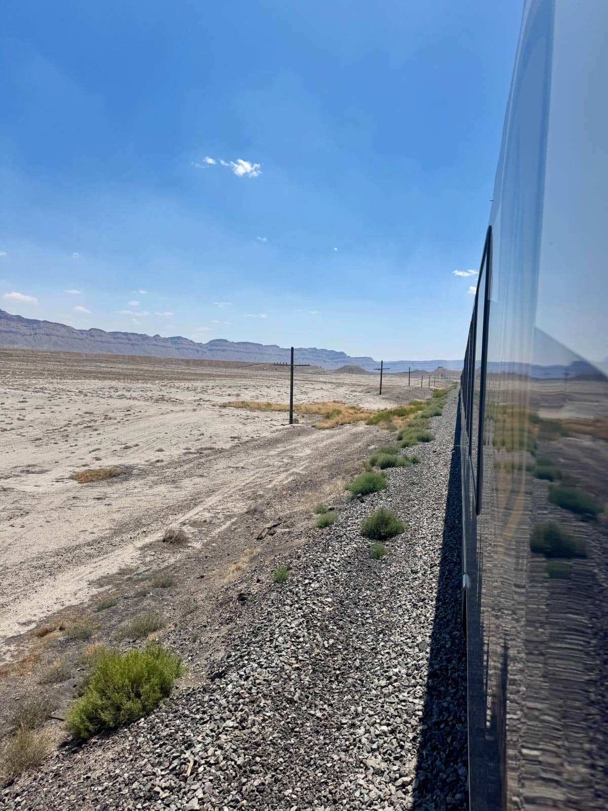 Side of train as it rolls through the desert.