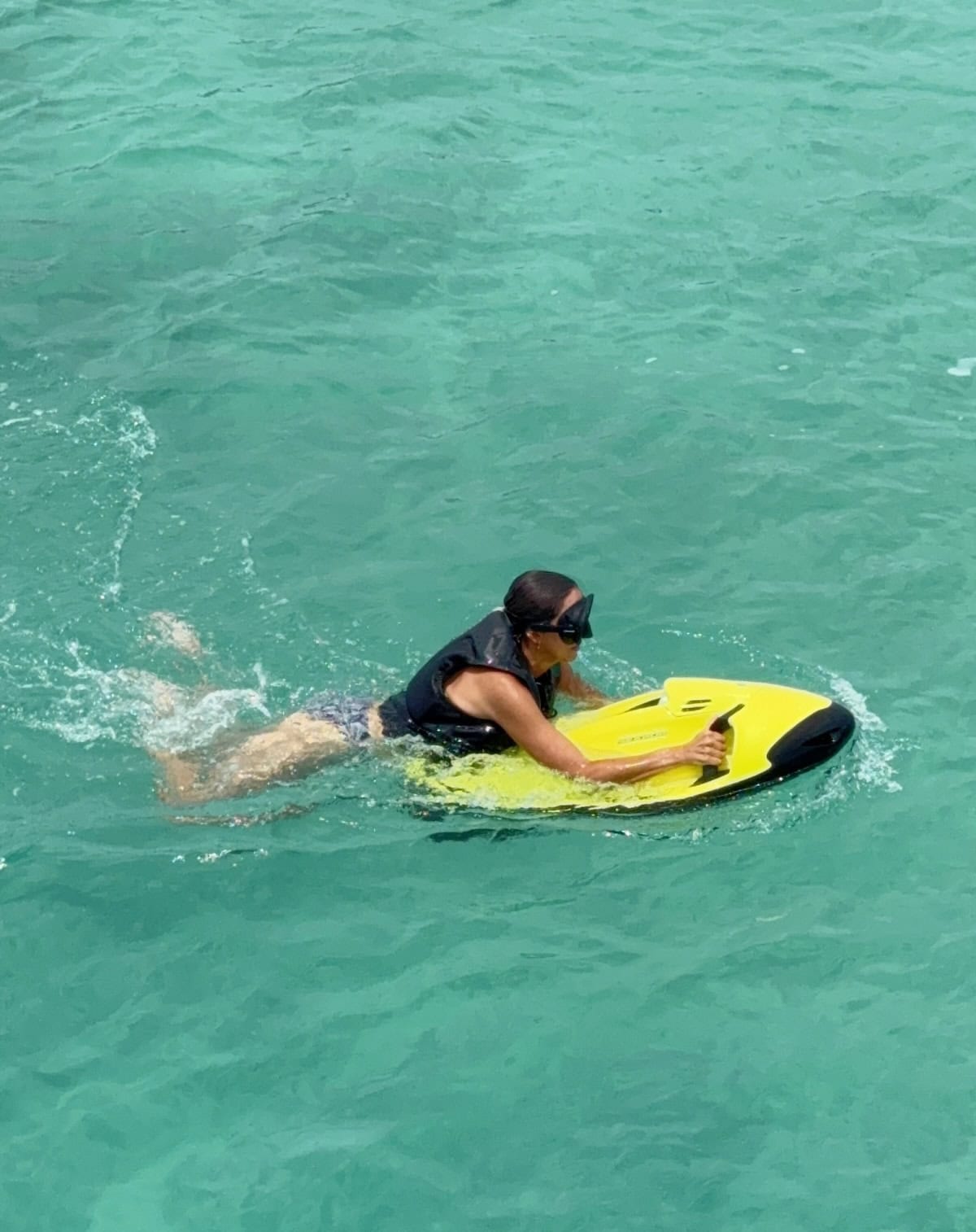 Woman on a seabob in the bay.