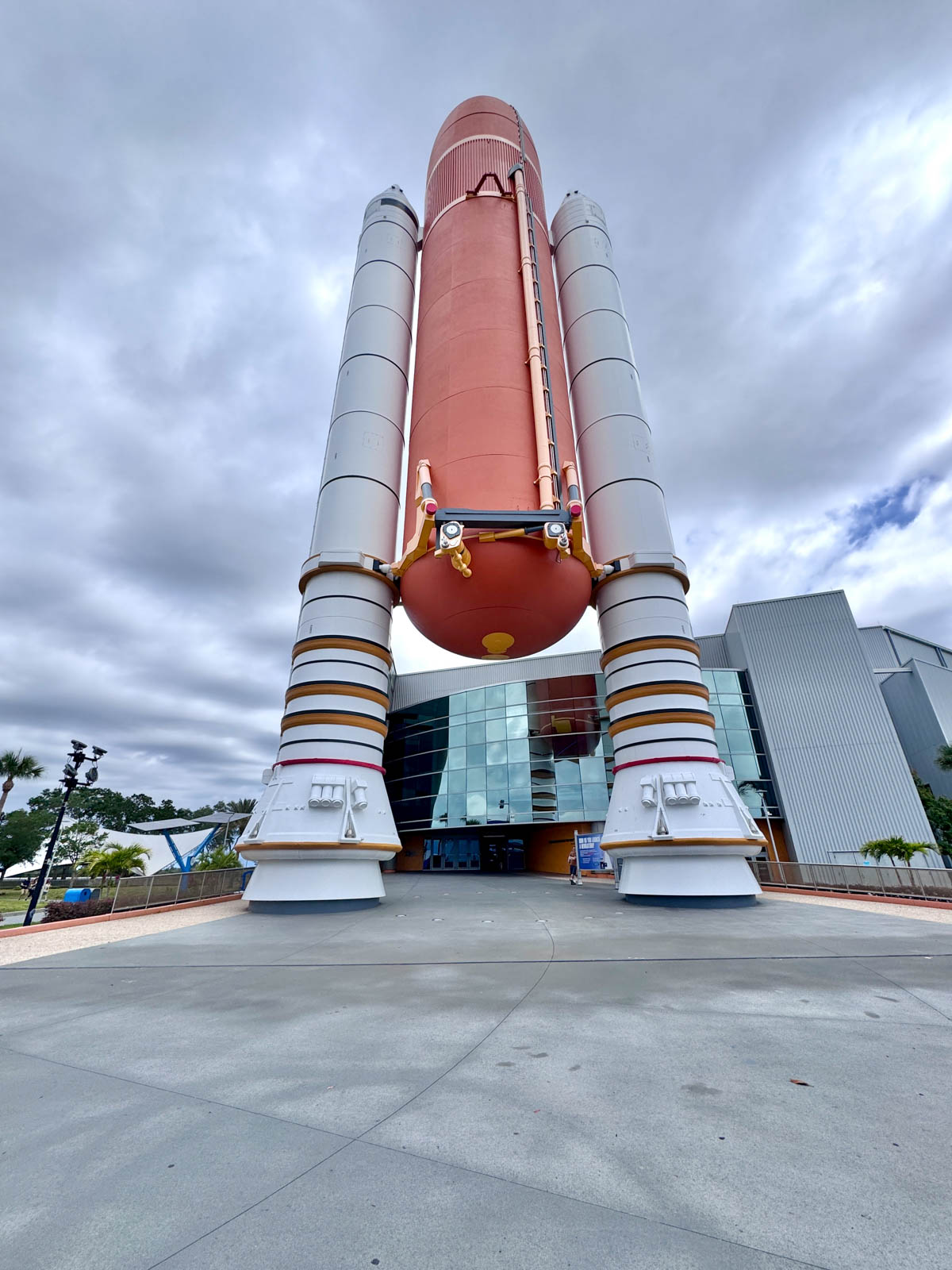 Rocket in front of building.