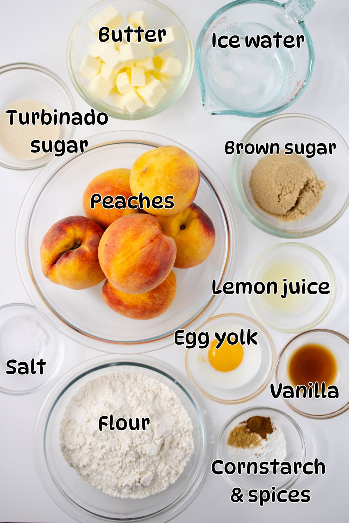 Ingredients for peach galette on white counter, labeled for context.