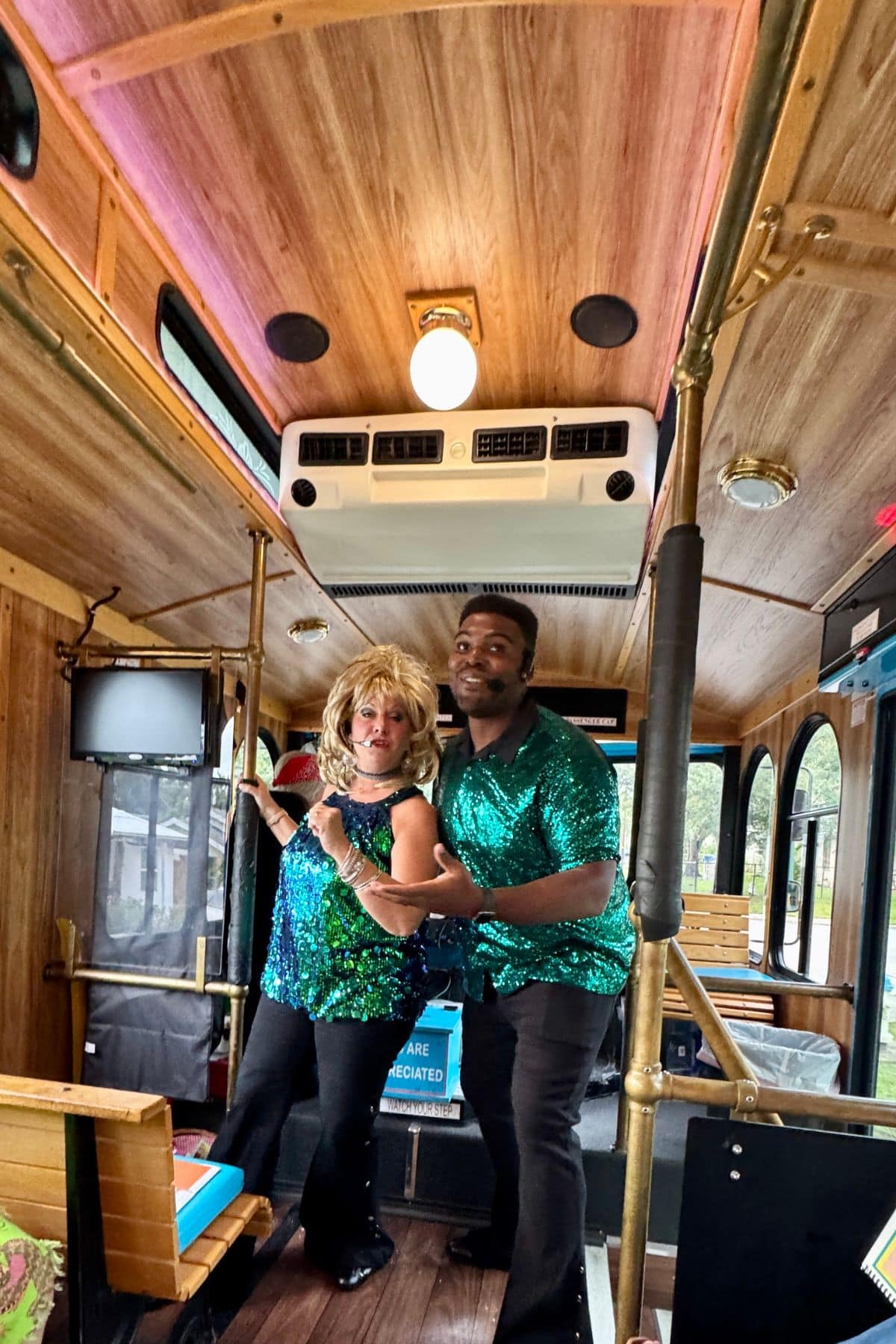 Singing performers on a trolley bus.