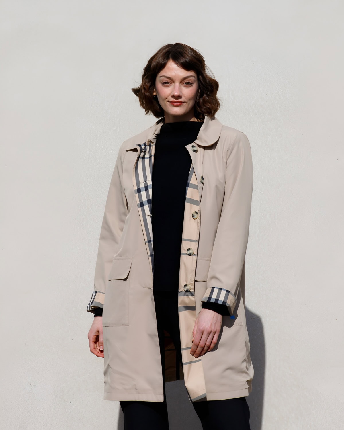Woman in trench coat.