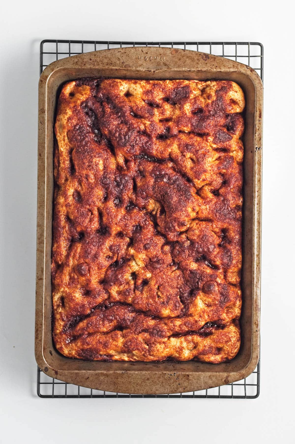 Baked focaccia bread with cinnamon and sugar.