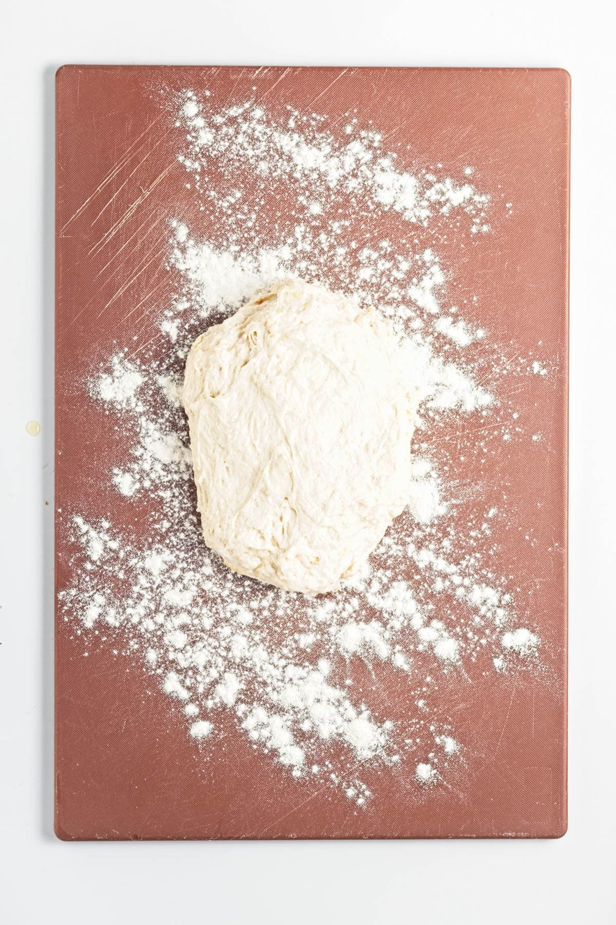 Dough on a cutting board.